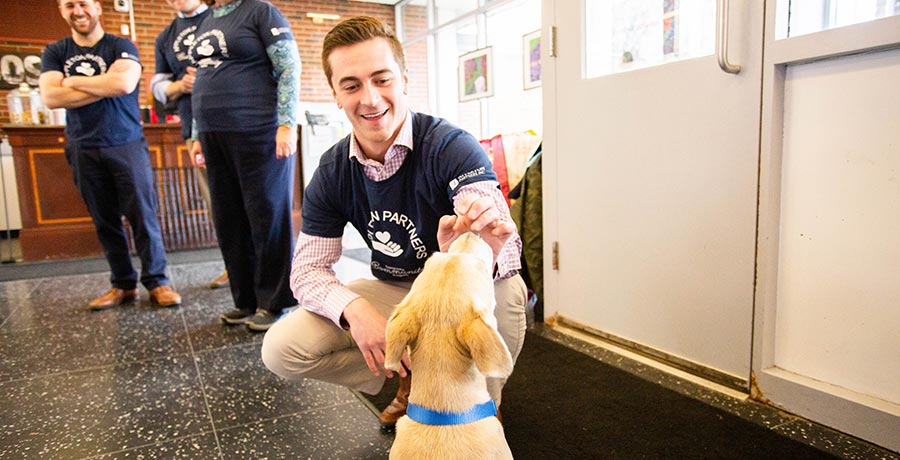 group volunteers with puppy