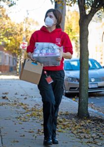 ARL staff member delivering pet food for Keep Pets S.A.F.E. Program