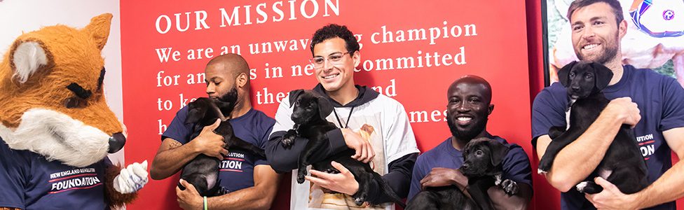 New England Revolution players with ARL puppies