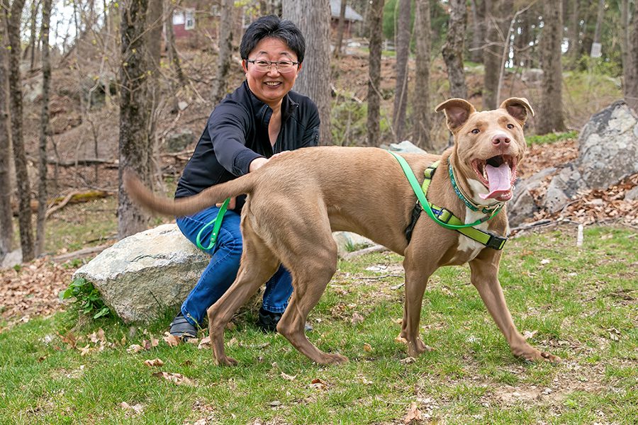 Ning with her dog, Buddy, outside